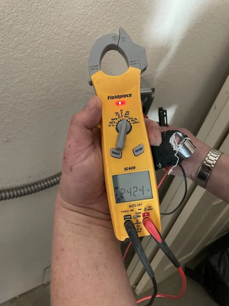 Voltage testing with clamp meter during Ceiling Fan Installation in Franklin Lakes